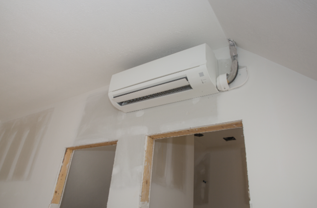 Mini-Split Ductless Heat Pump Installed on Wall in Unifinished Room