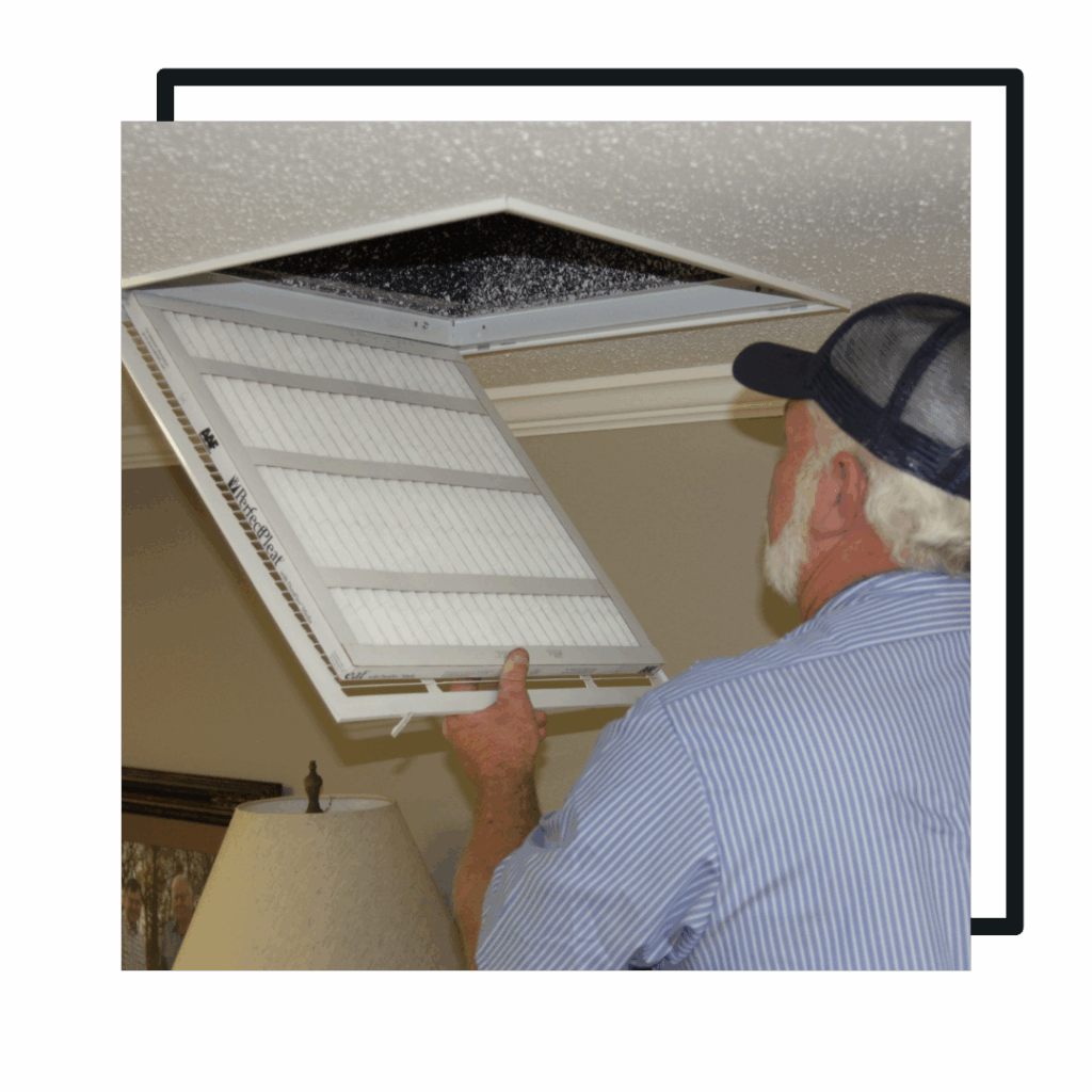 man checking HVAC filter